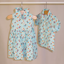 Load image into Gallery viewer, Children's dress in pelican print. Baby blue with cute pelicans.