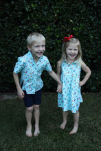 Load image into Gallery viewer, Children's dress in pelican print. Baby blue with cute pelicans.