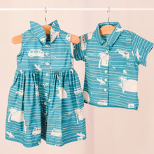 Load image into Gallery viewer, Our playful, button-up dress has just the right amount of poof and twirl.  The sleeveless style lets your child play with ease and we even added pockets so your littles can stow away their treasures.